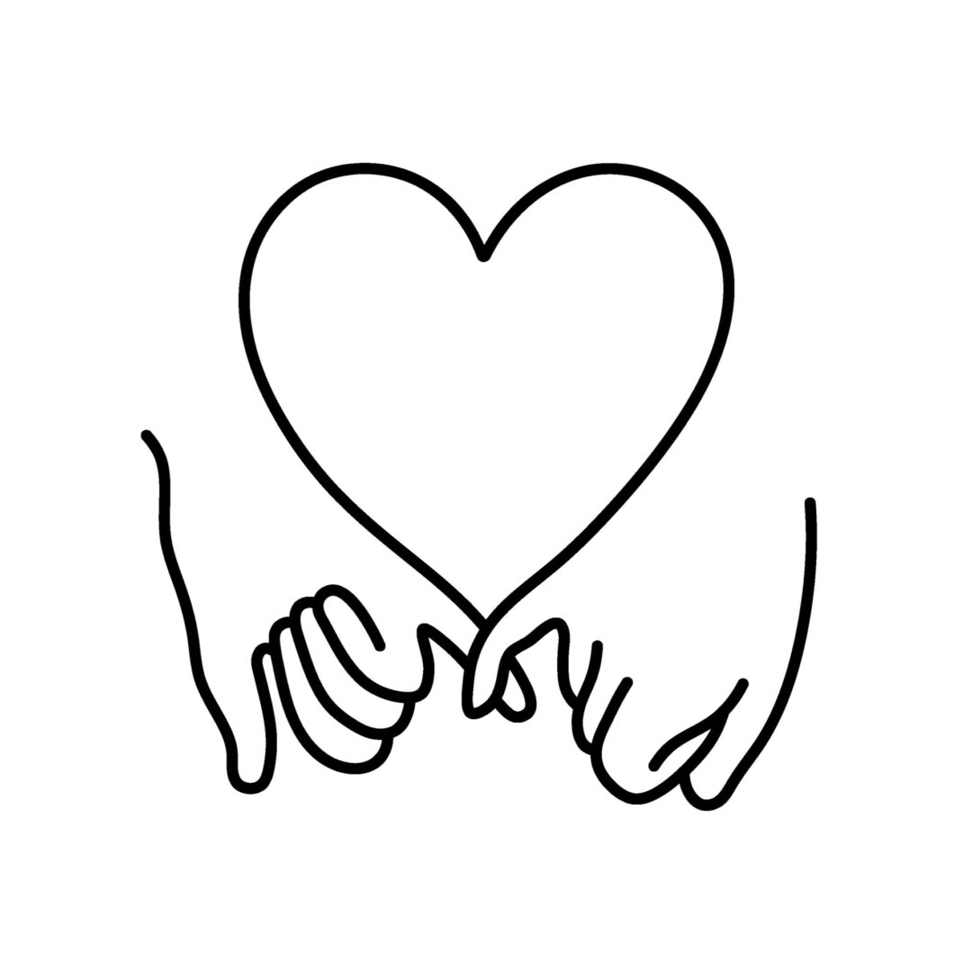 A heart shaped object is held by two hands.